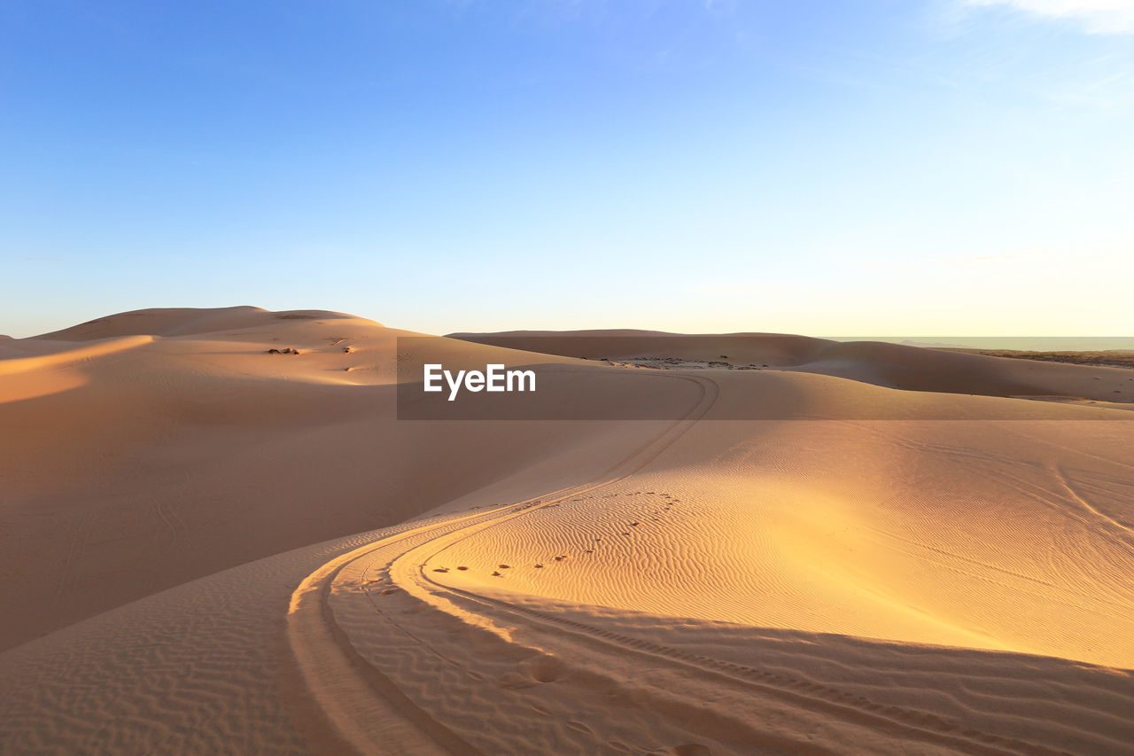 Scenic view of desert against clear sky