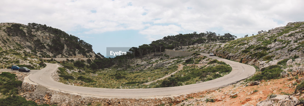 Scenic view of mountain road against sky