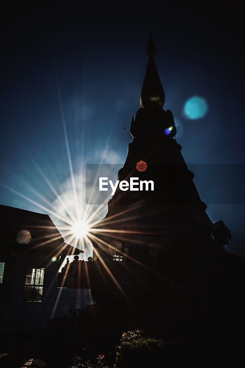 LOW ANGLE VIEW OF ILLUMINATED CHURCH
