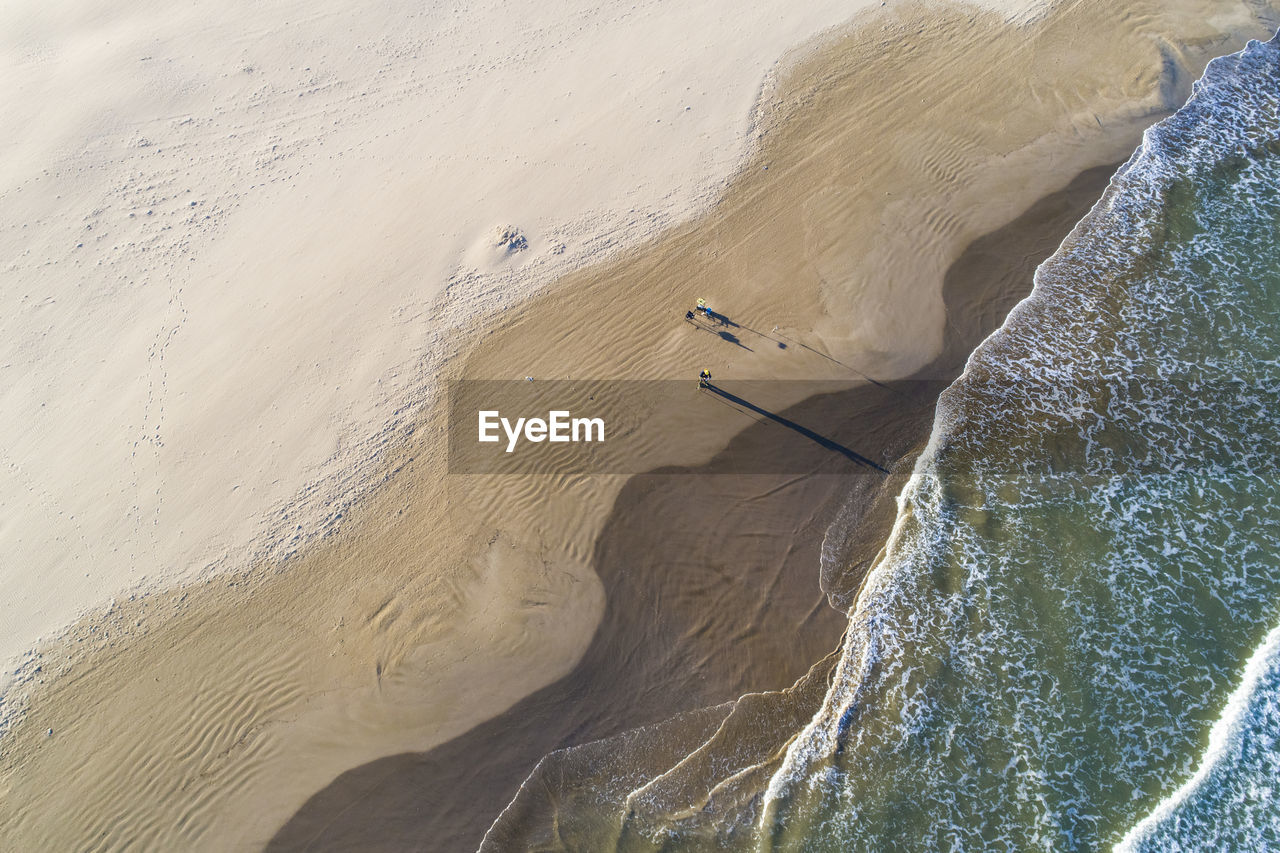 Aerial abstract view of valencia beach with waves and wet sand