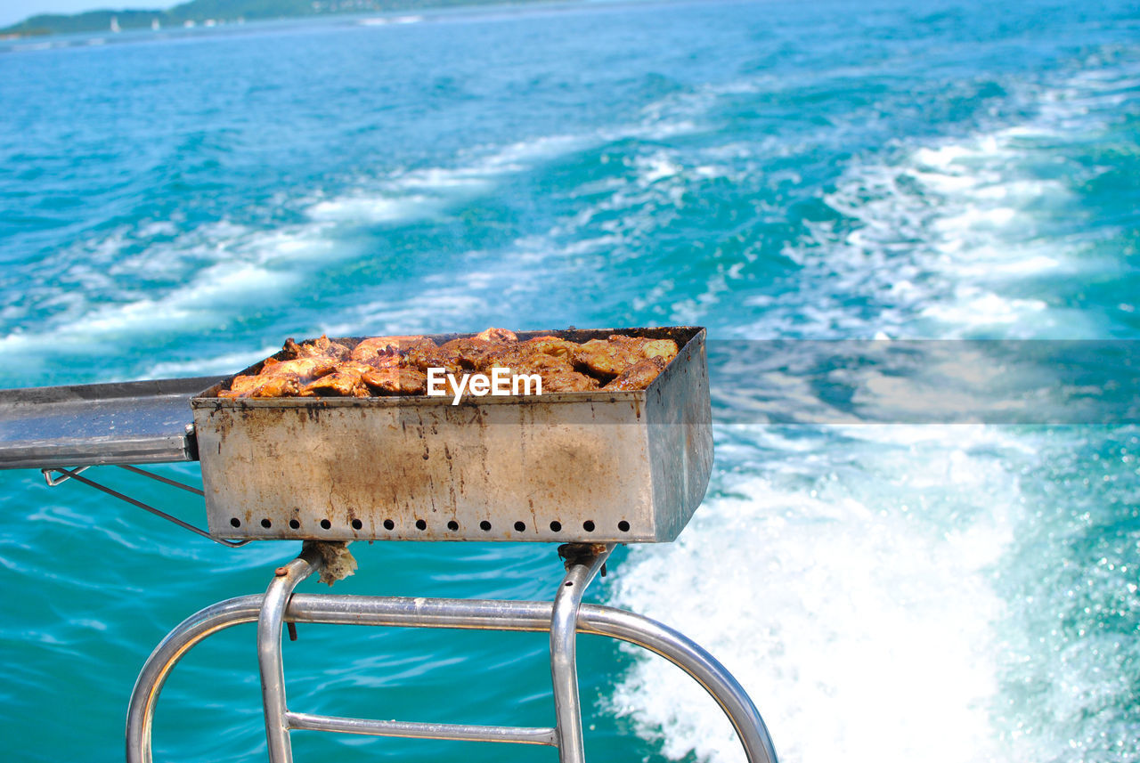 Barbecue on catamaran boat on blue sea in mauritius 