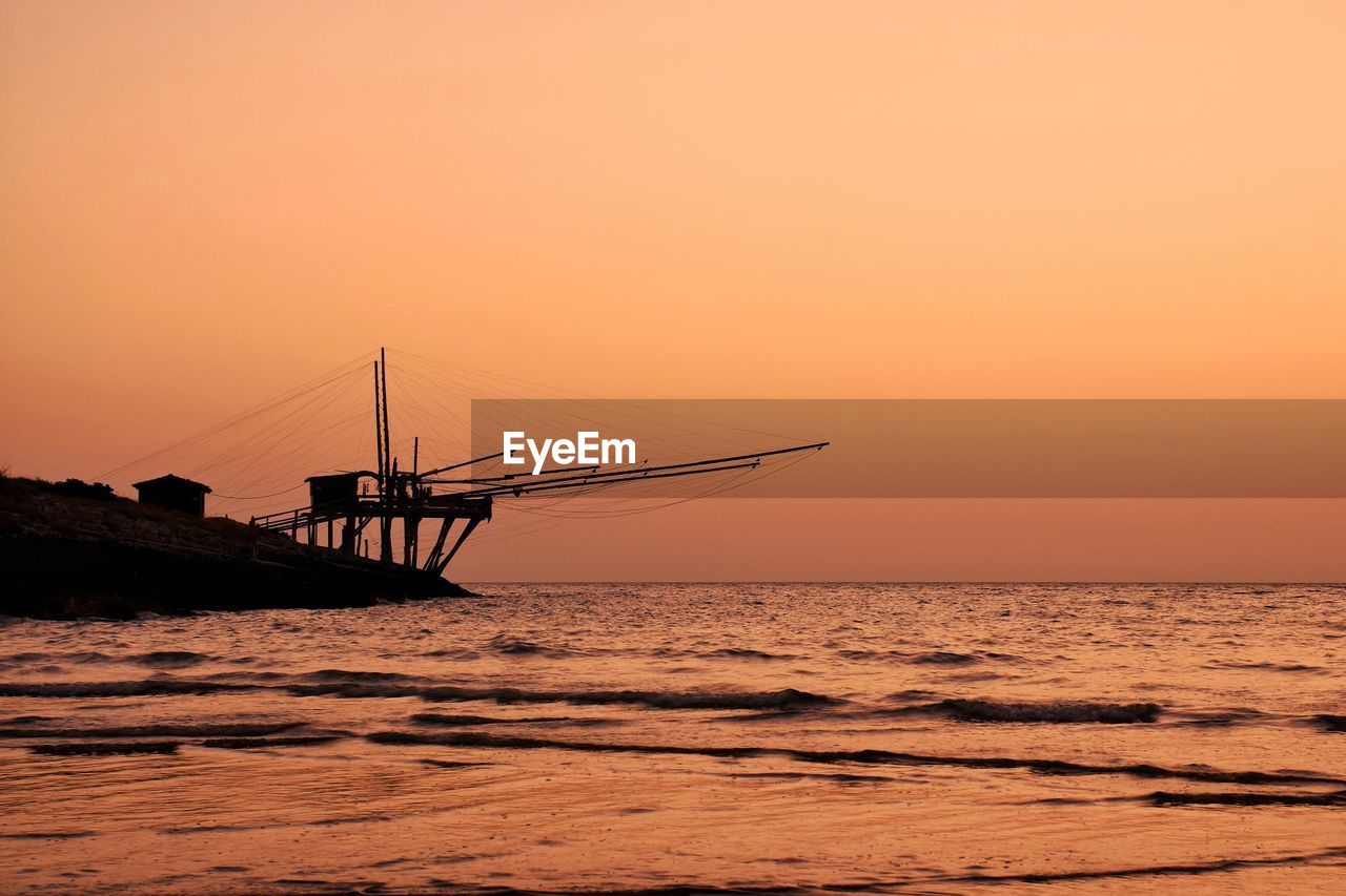 Scenic view of sea against sky during sunrise