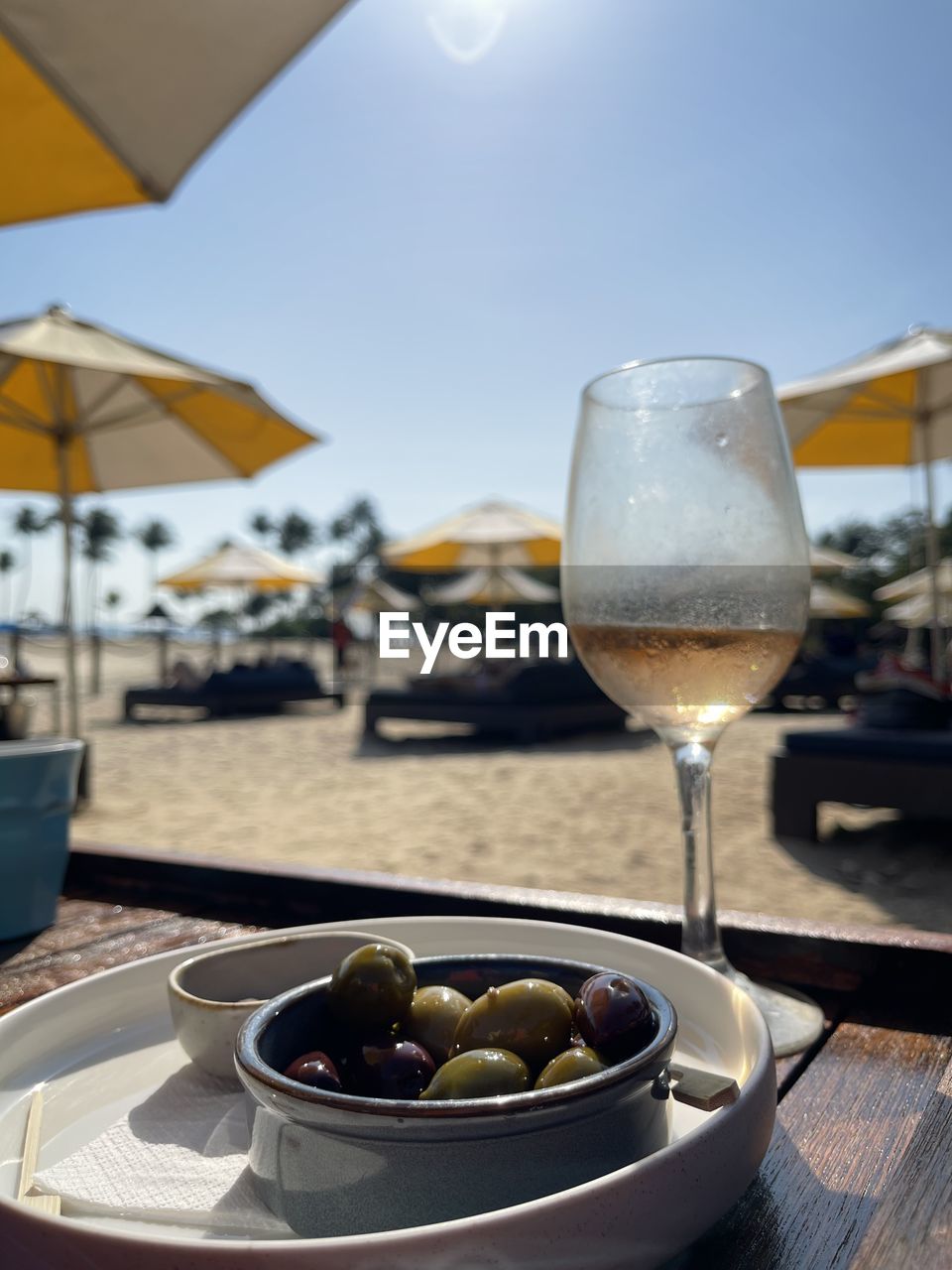 Wineglass on table in restaurant beach