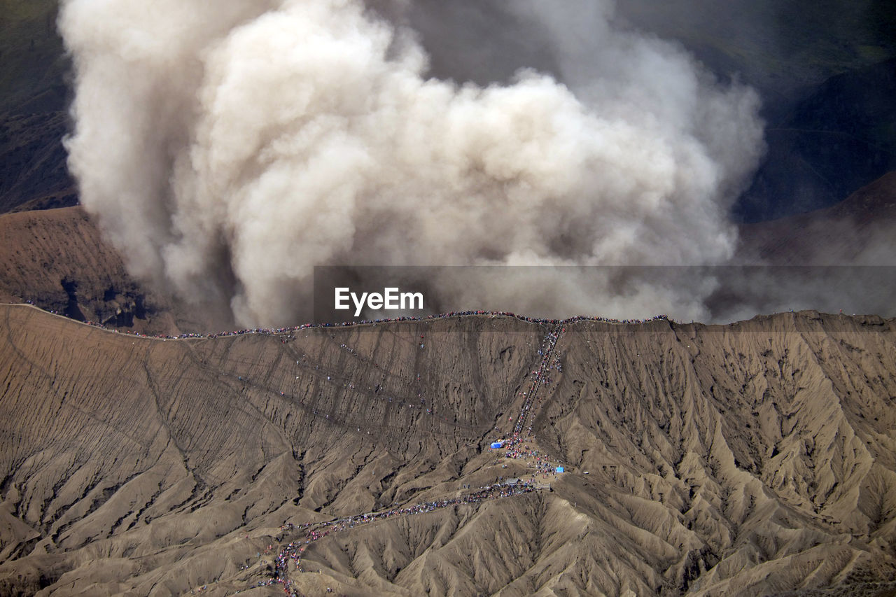 Smoke emitting from volcanic mountain