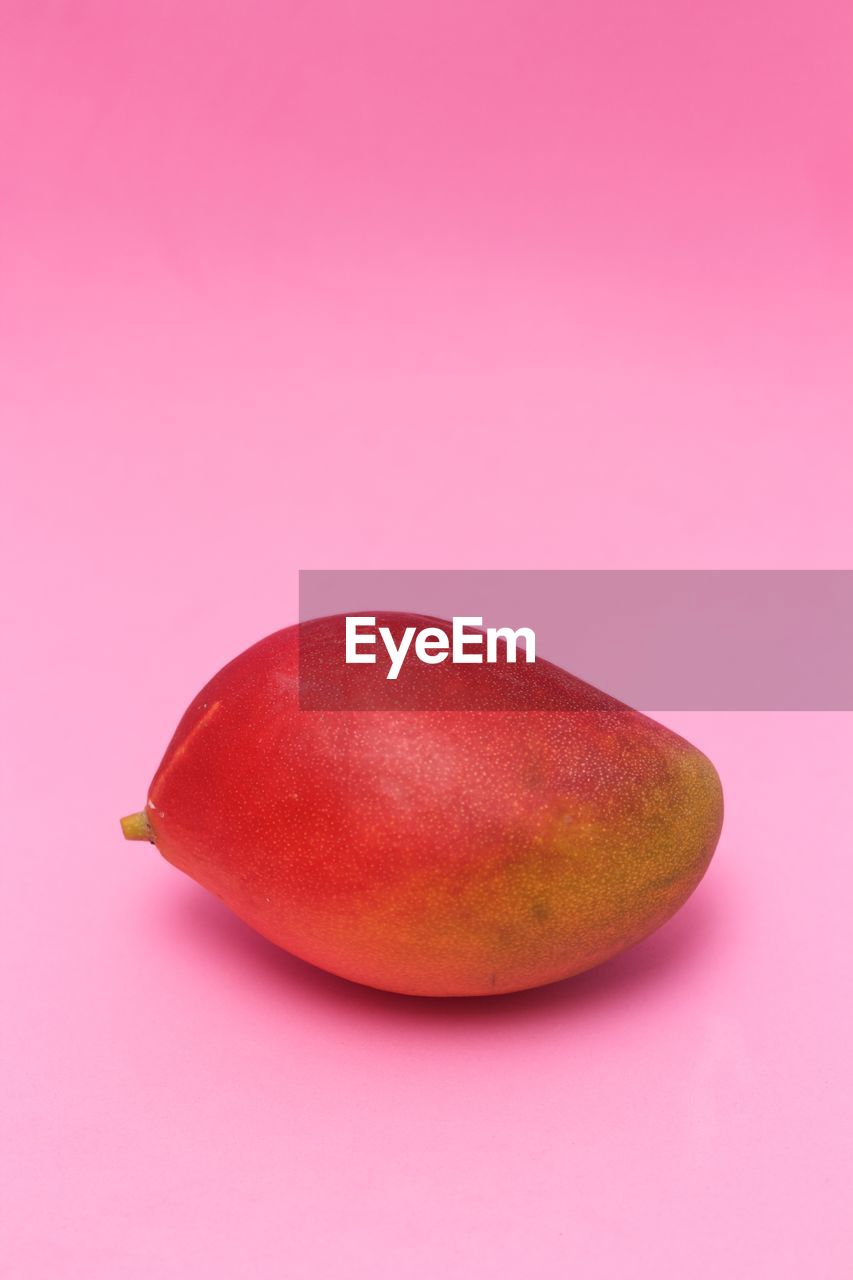 Mango in pink background
