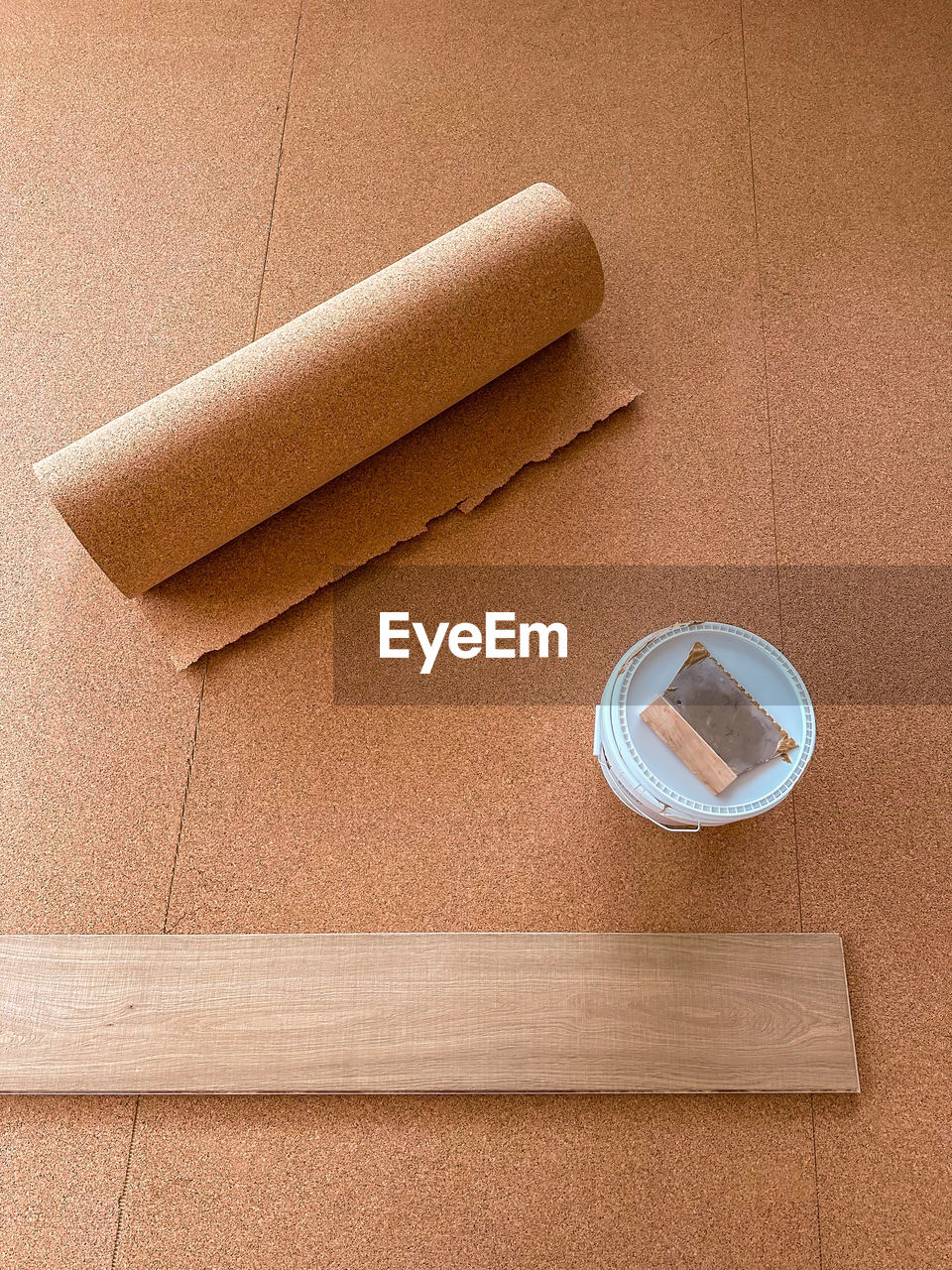 Cork is laid on the floor to insulate against impact sound.