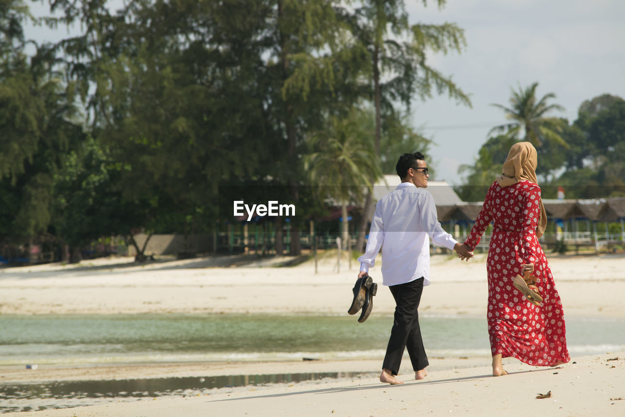 Couple walking on beach