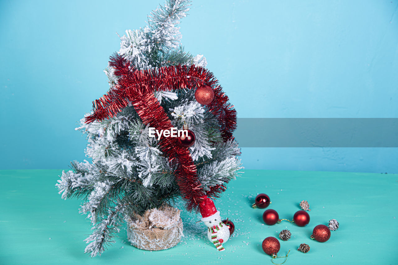 Close-up of christmas tree on blue background