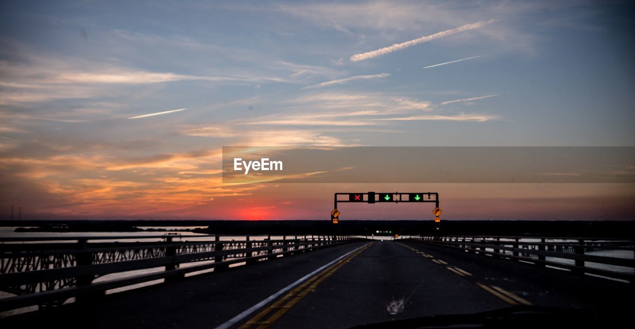 Street against sky during sunset