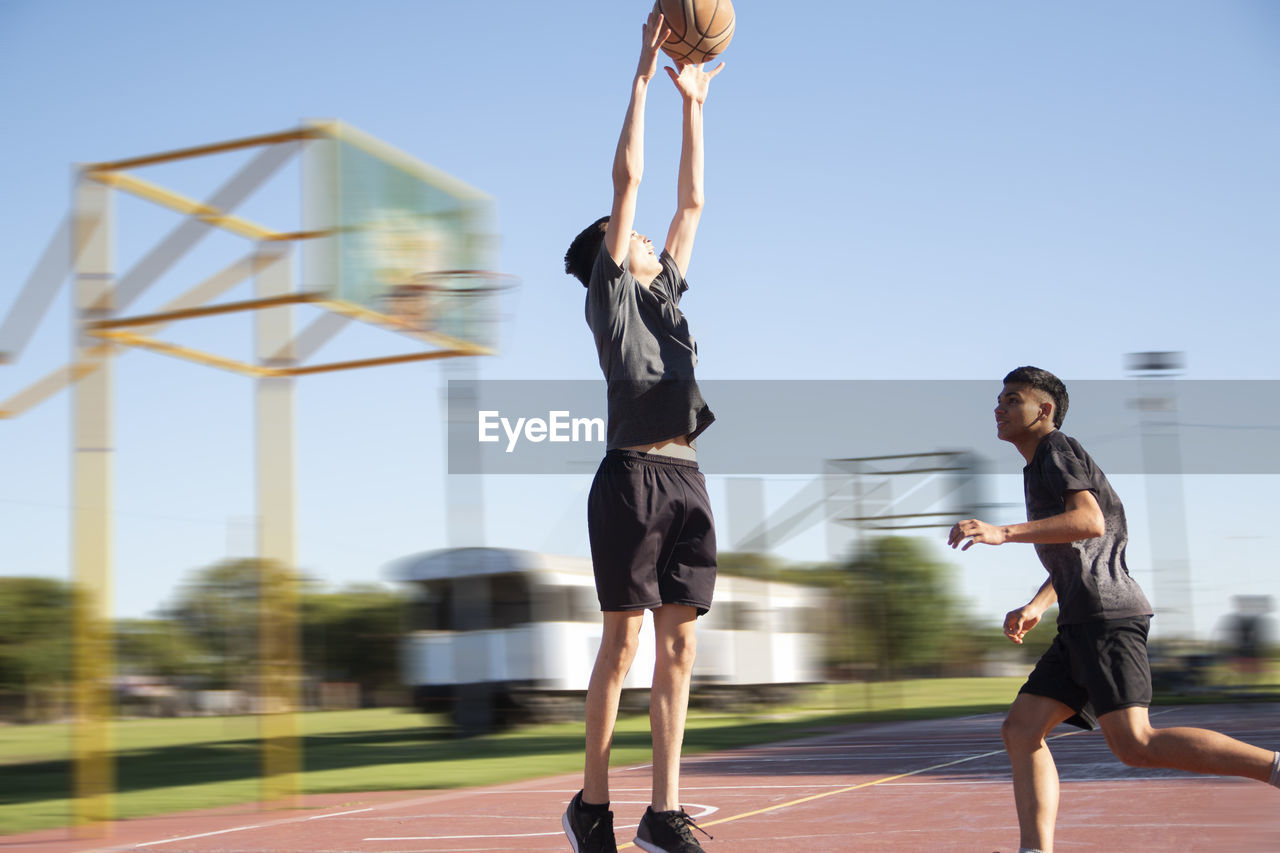 Portrait of young basketball player jumping