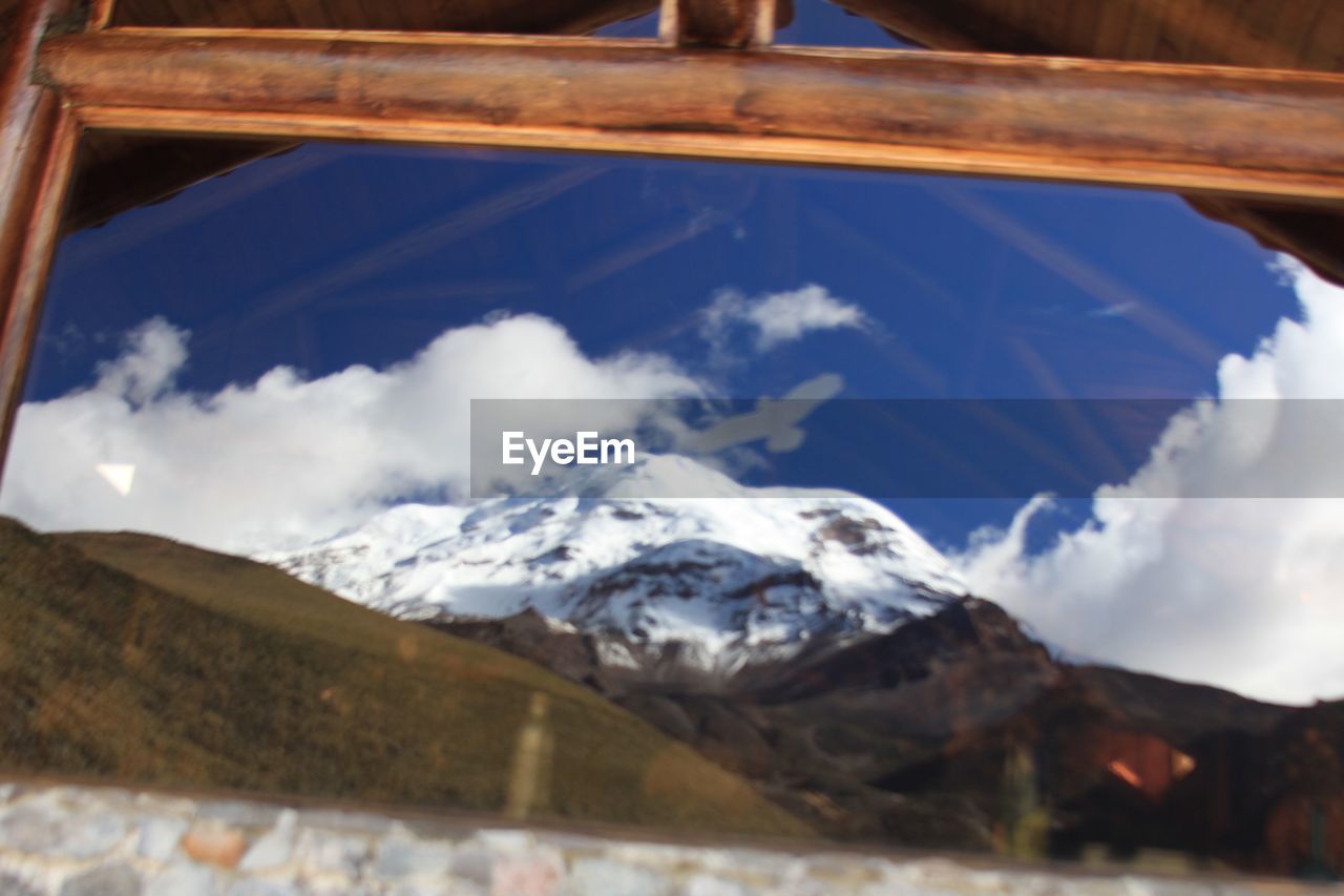 MAJESTIC SNOWCAPPED MOUNTAINS AGAINST SKY