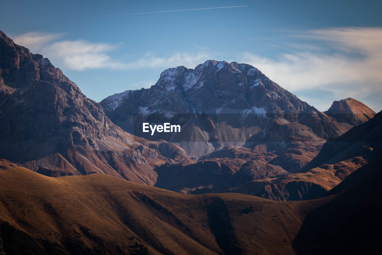 Scenic view of mountain ranges against sky