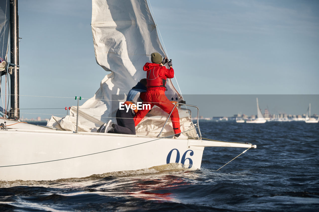 boat sailing in sea against sky