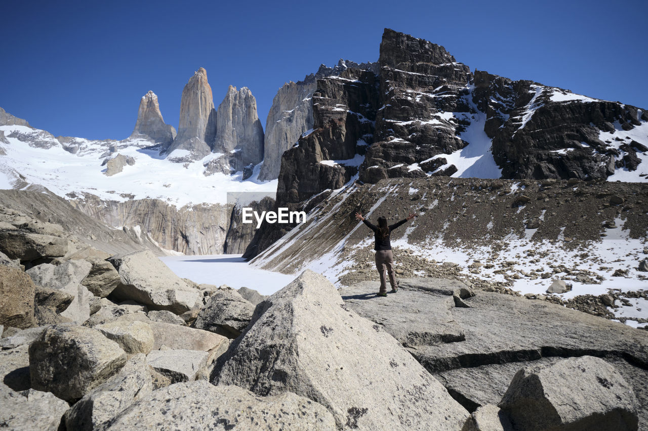 PANORAMIC VIEW OF SNOWCAPPED MOUNTAIN AGAINST CLEAR SKY