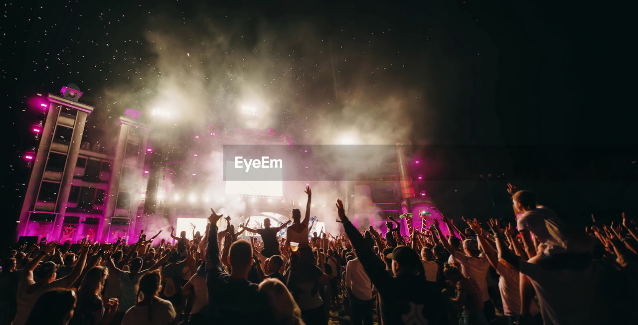 Crowd at music concert during night