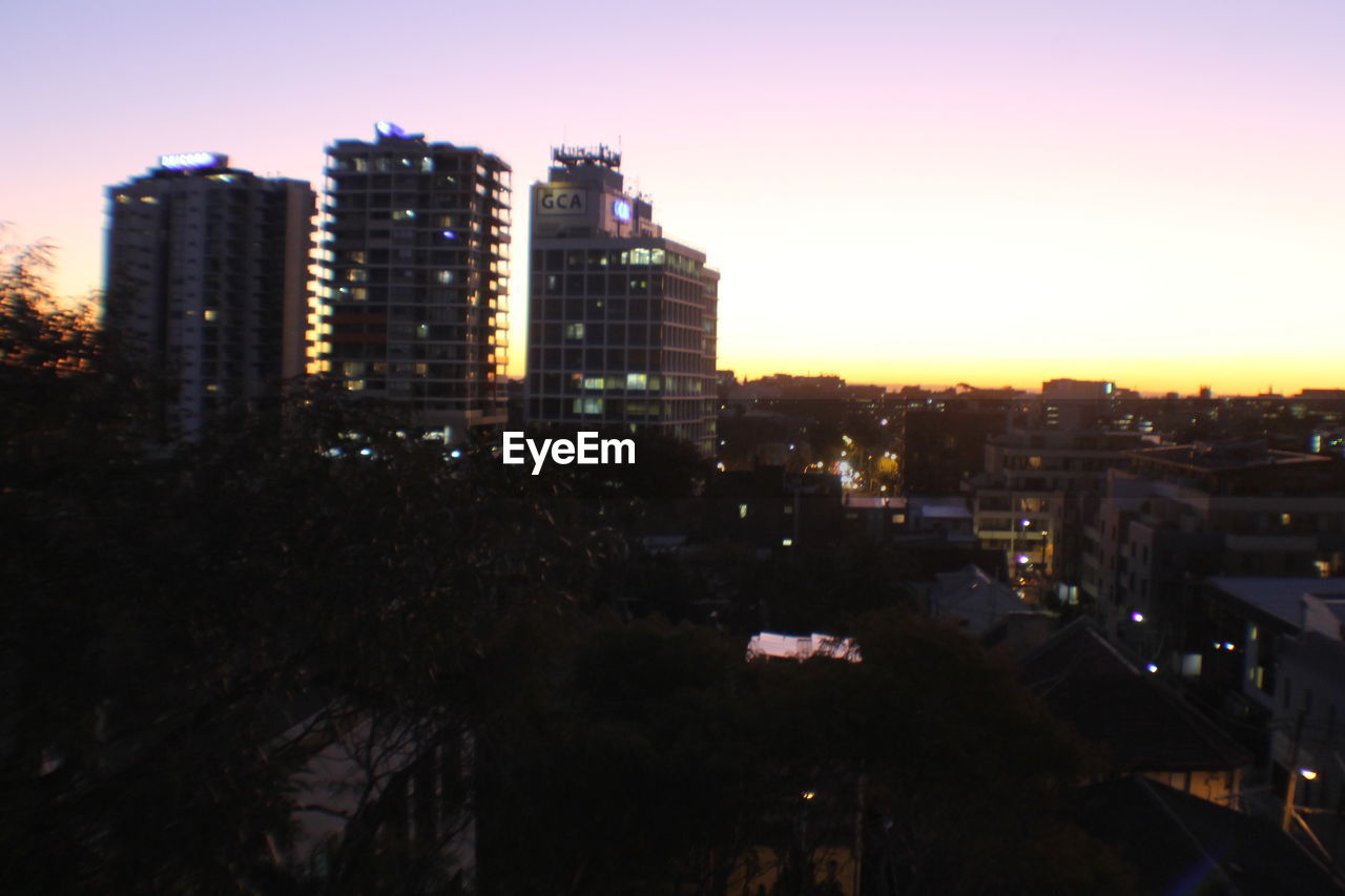 VIEW OF CITYSCAPE AT SUNSET