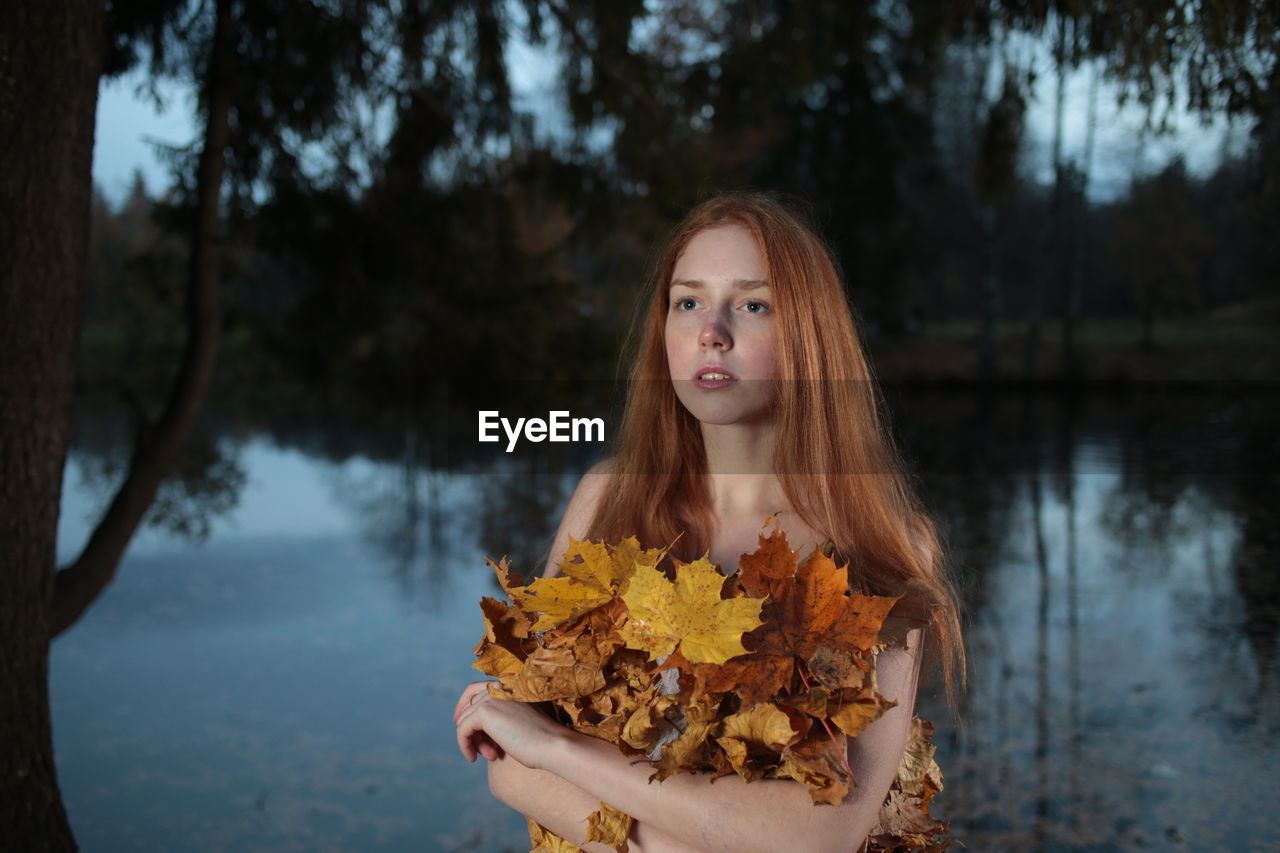 PORTRAIT OF YOUNG WOMAN IN WATER