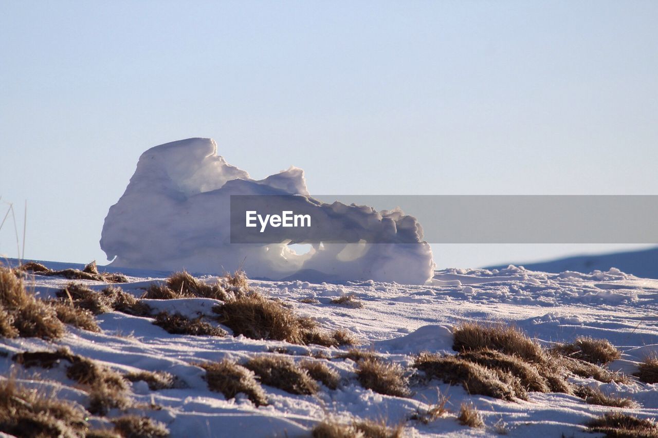 Scenic view of frozen sea against clear sky