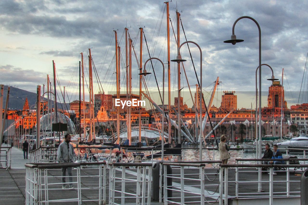 BOATS MOORED AT HARBOR