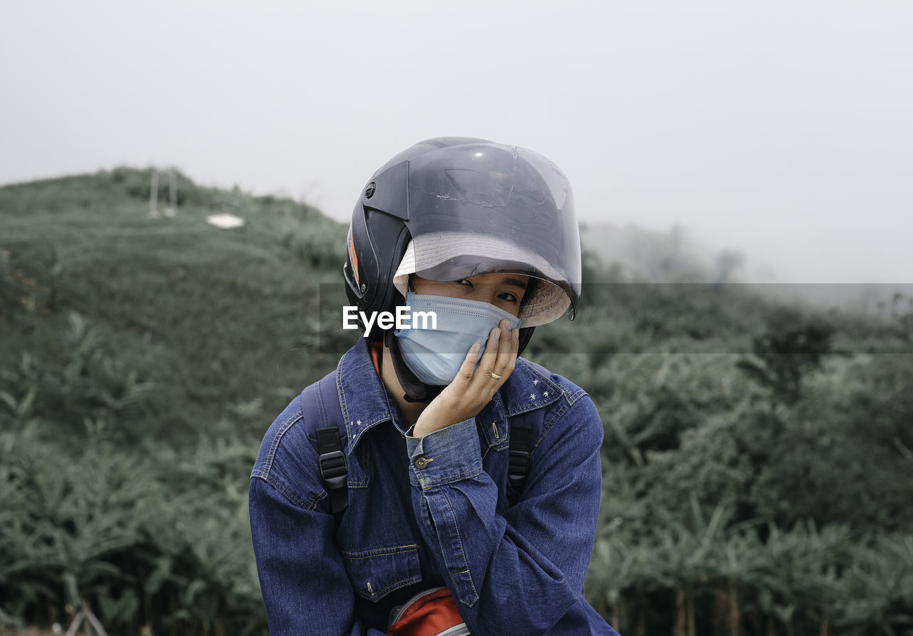 Portrait of boy wearing sunglasses on field