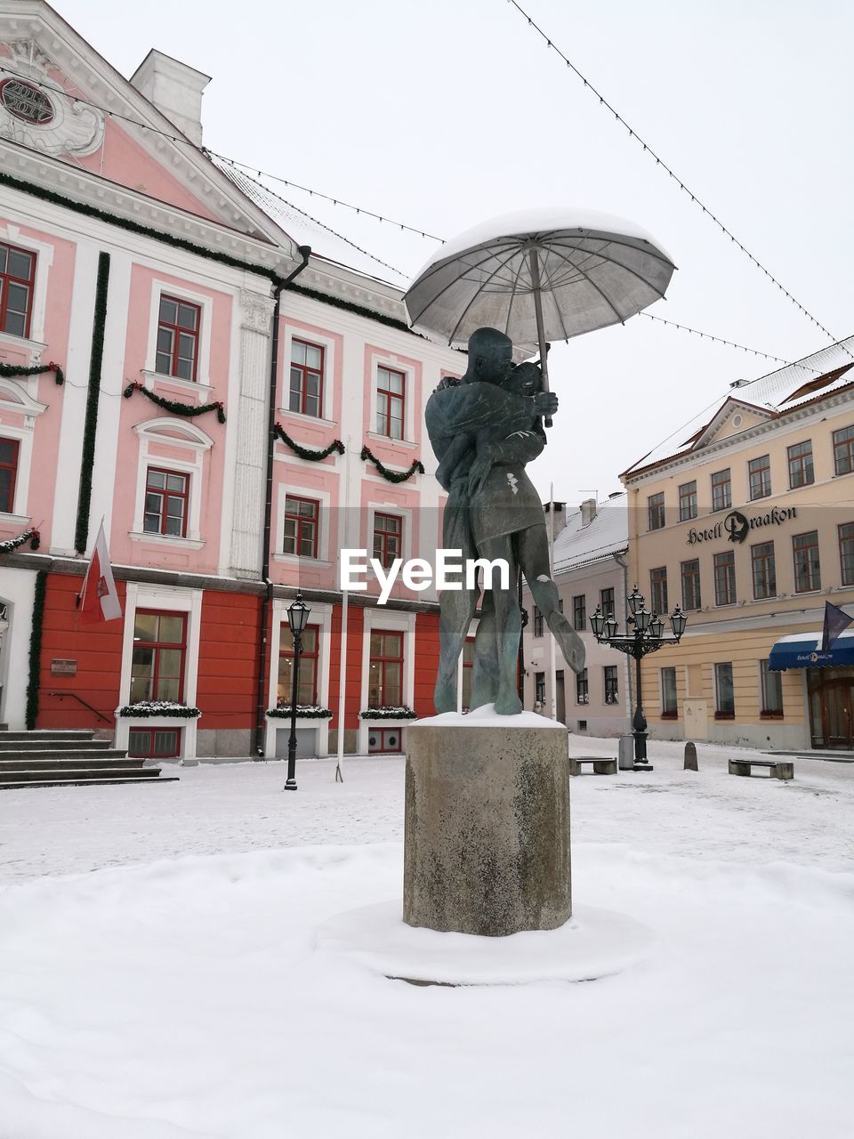 STATUE IN CITY DURING WINTER