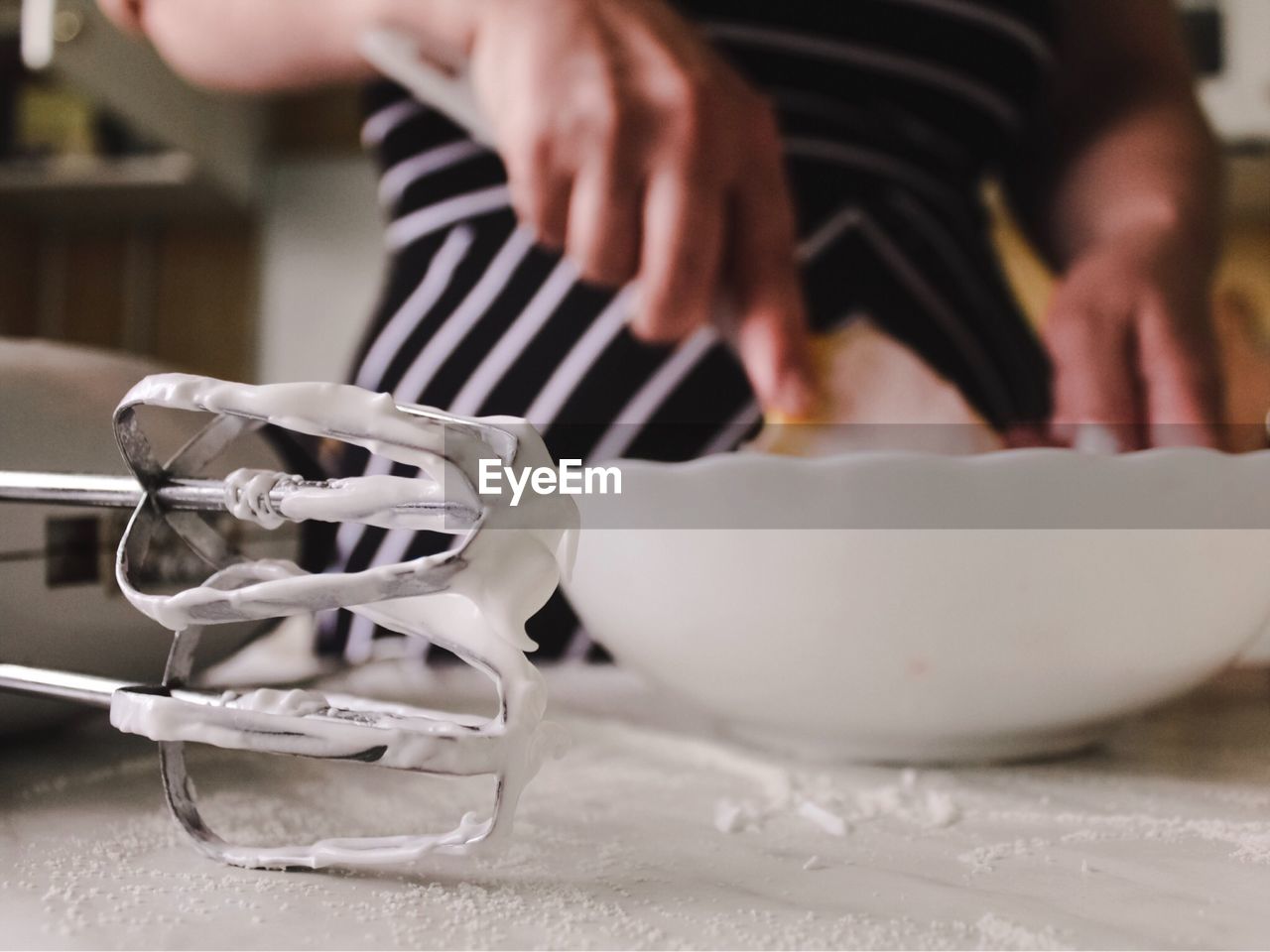 Midsection of woman preparing food at table