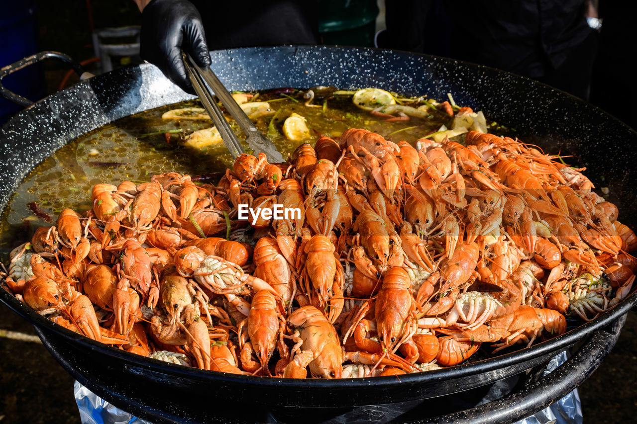 Hand cooking lobsters