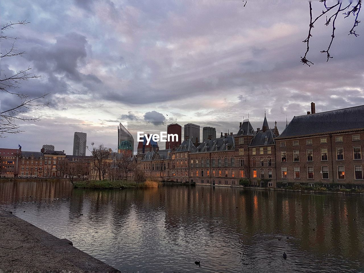 CITYSCAPE AGAINST SKY AT SUNSET