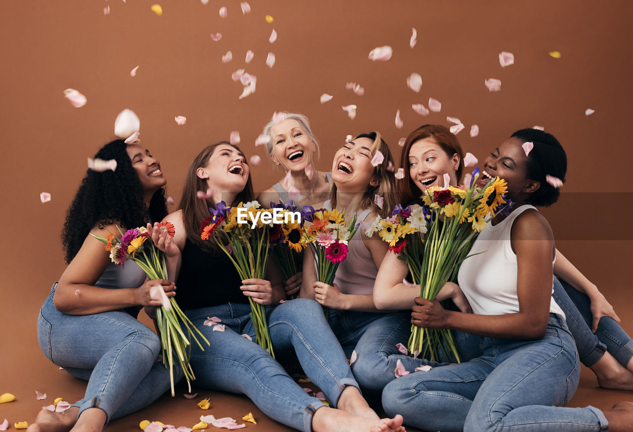 Group of people sitting on wall