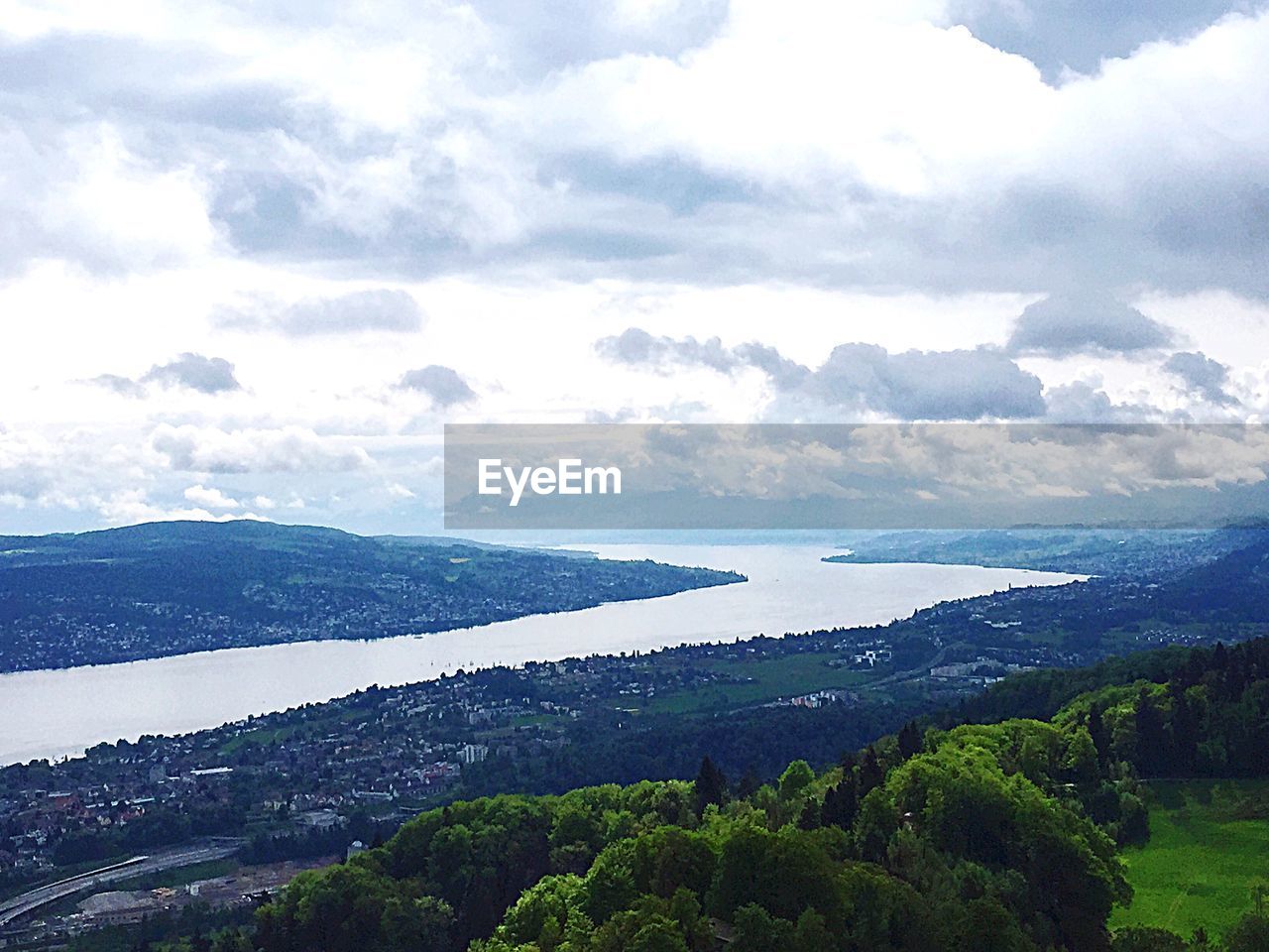 SCENIC VIEW OF MOUNTAINS AGAINST CLOUDY SKY