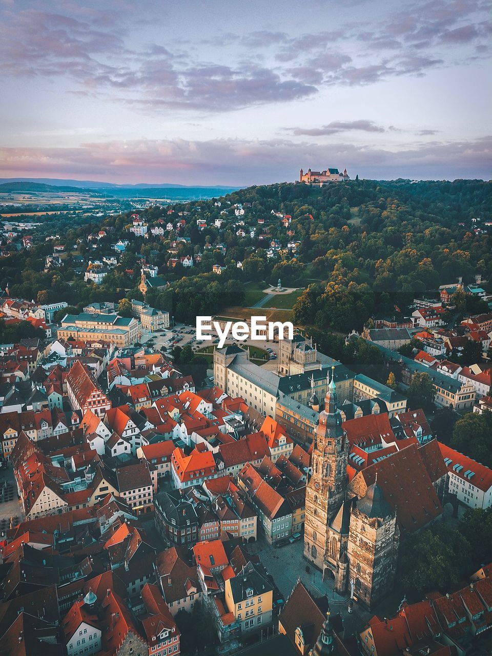 Aerial view of townscape against sky at sunset