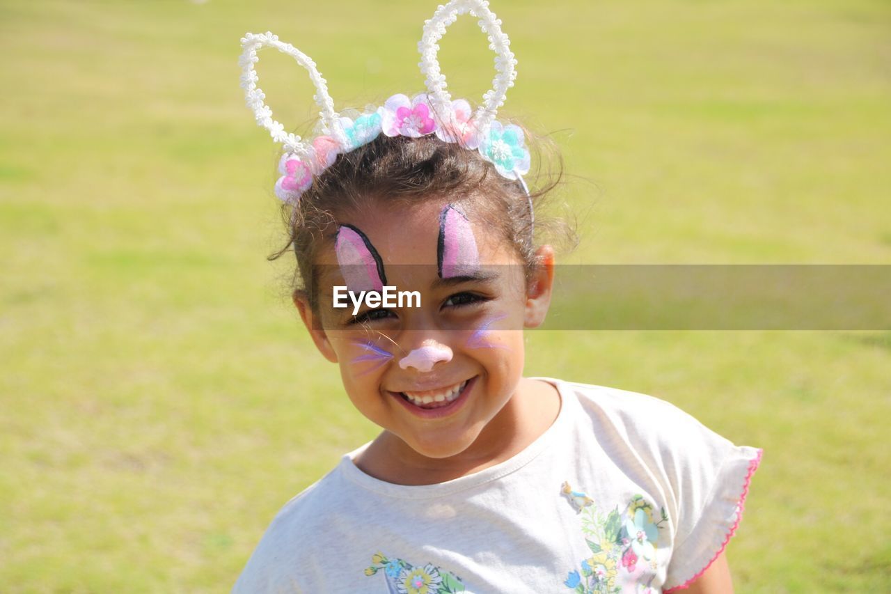 Portrait of smiling girl with make-up