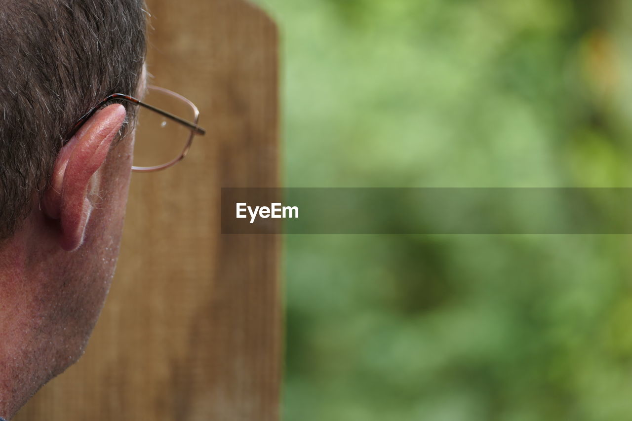 Cropped image of man wearing eyeglasses