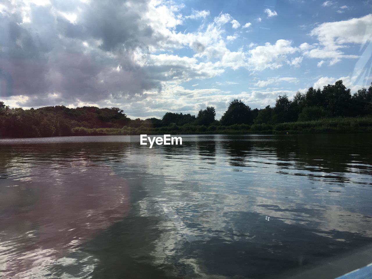 REFLECTION OF SKY ON LAKE