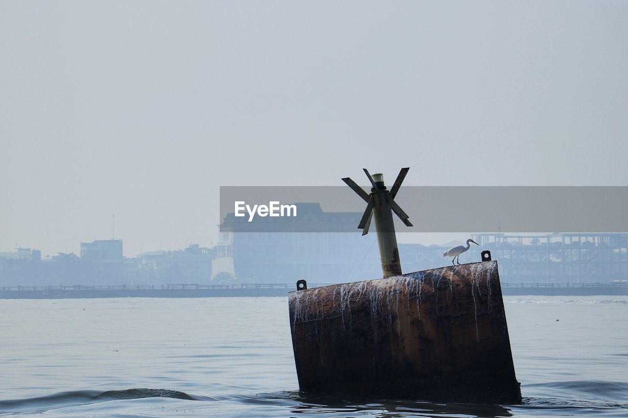 SHIP ON SEA AGAINST CLEAR SKY