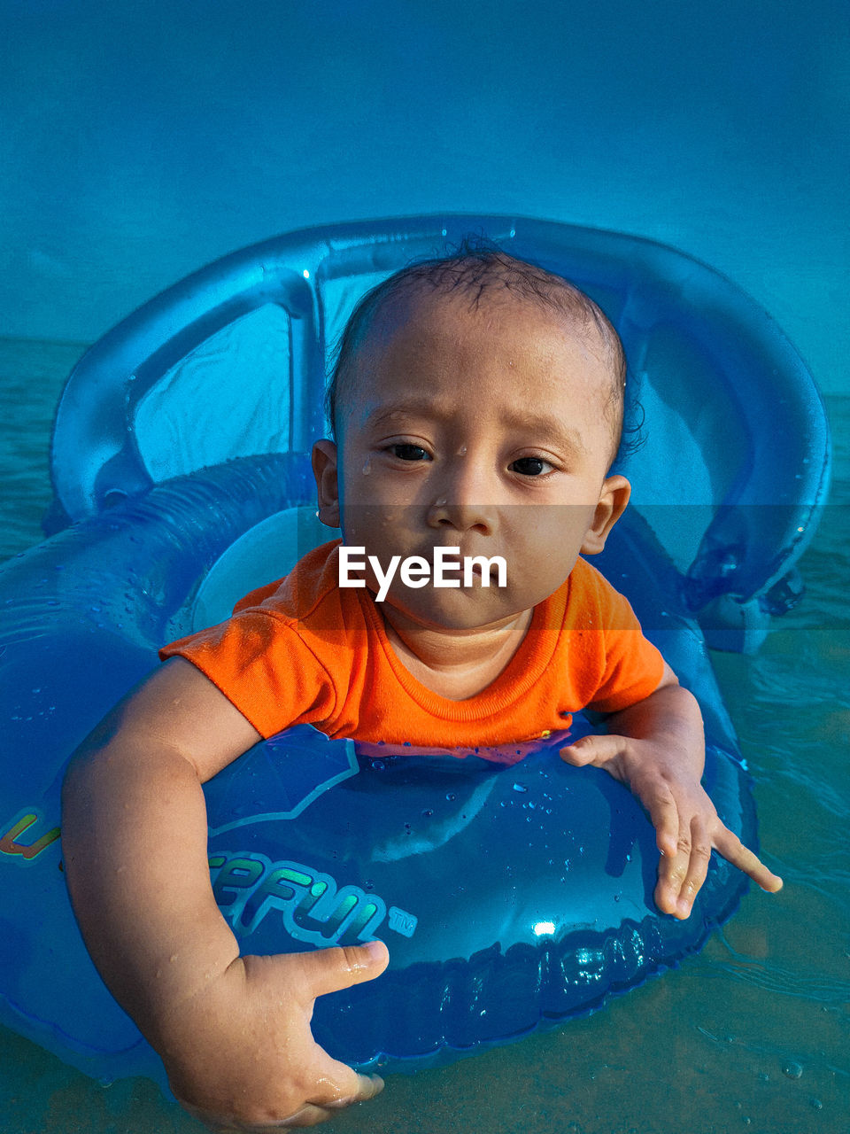 Portrait of cute boy in swimming pool