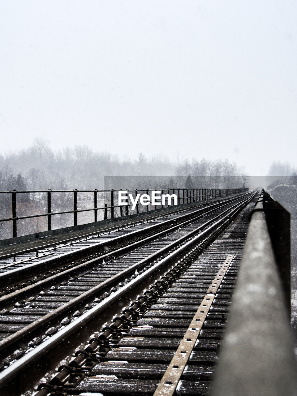 RAILROAD TRACK AGAINST SKY