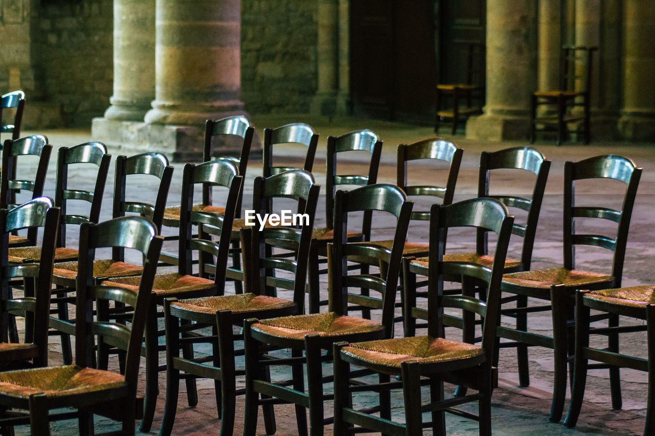 EMPTY CHAIRS AND TABLES AT RESTAURANT