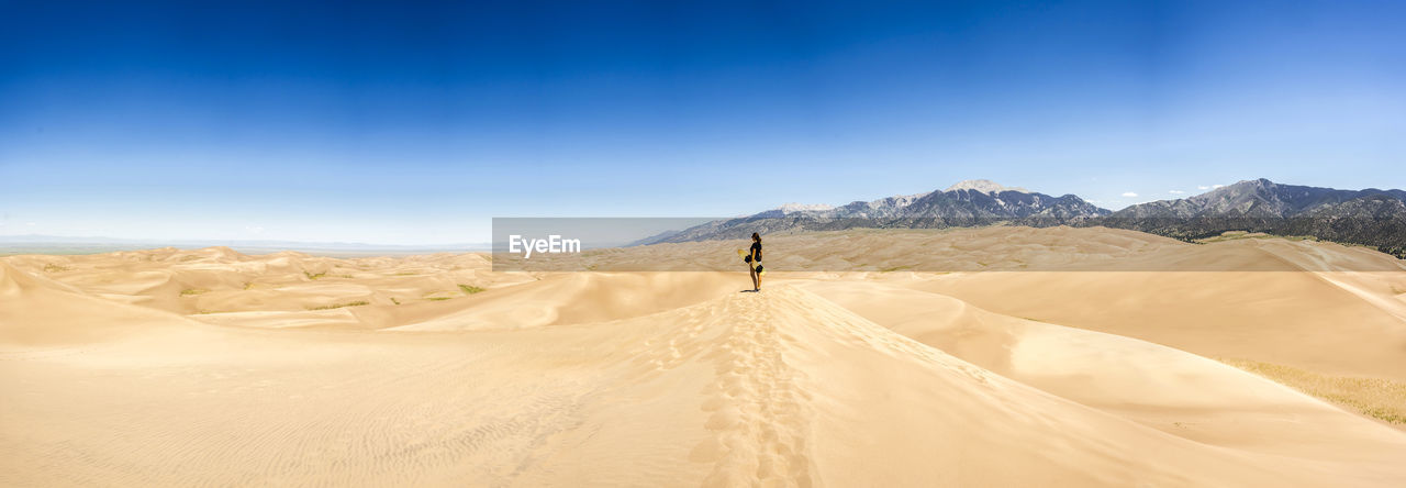 Woman at desert on sunny day