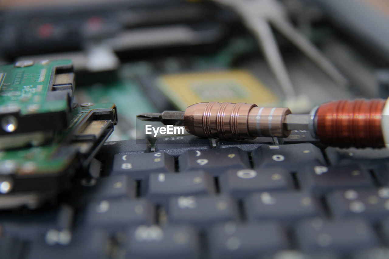 CLOSE-UP OF LAPTOP ON KEYBOARD