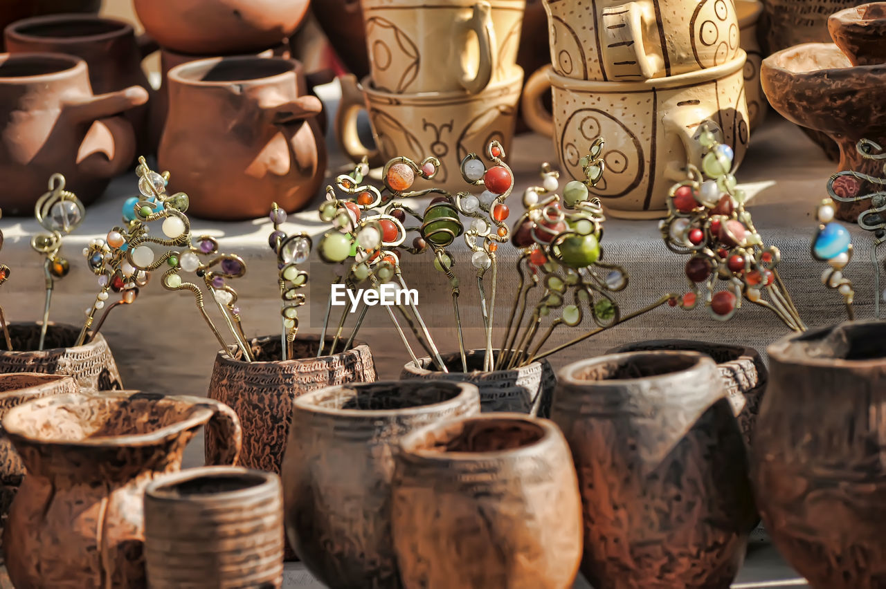 CLOSE-UP OF ANTIQUE FOR SALE IN MARKET