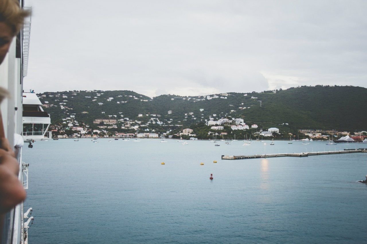 Calm sea with built structures in background