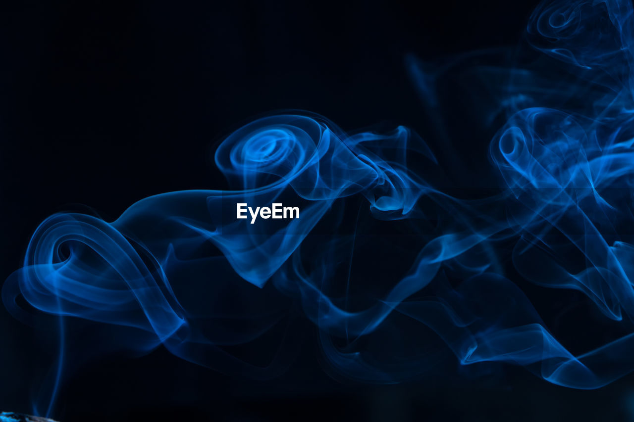 Close-up of smoke against black background