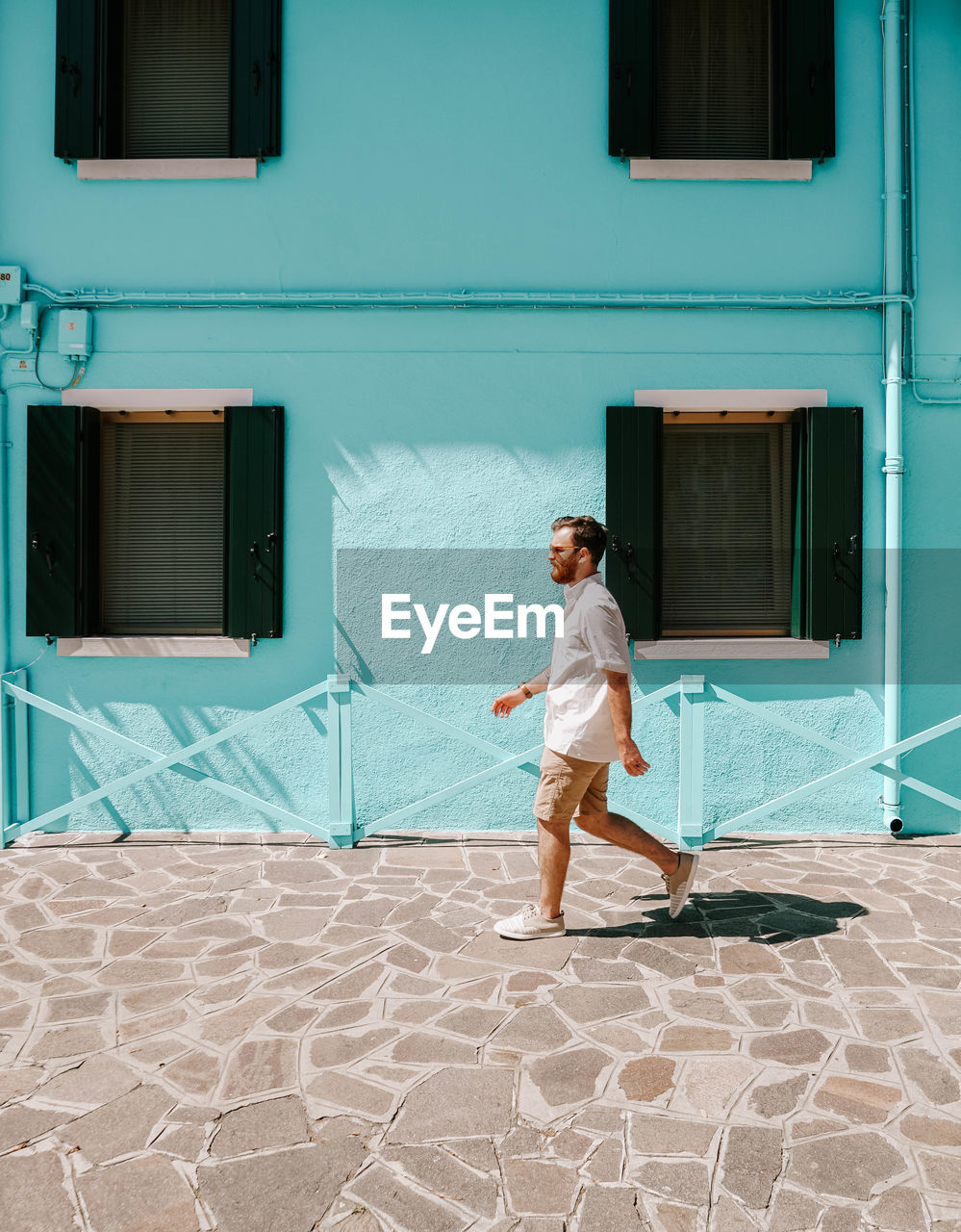 Full length of man standing outside building