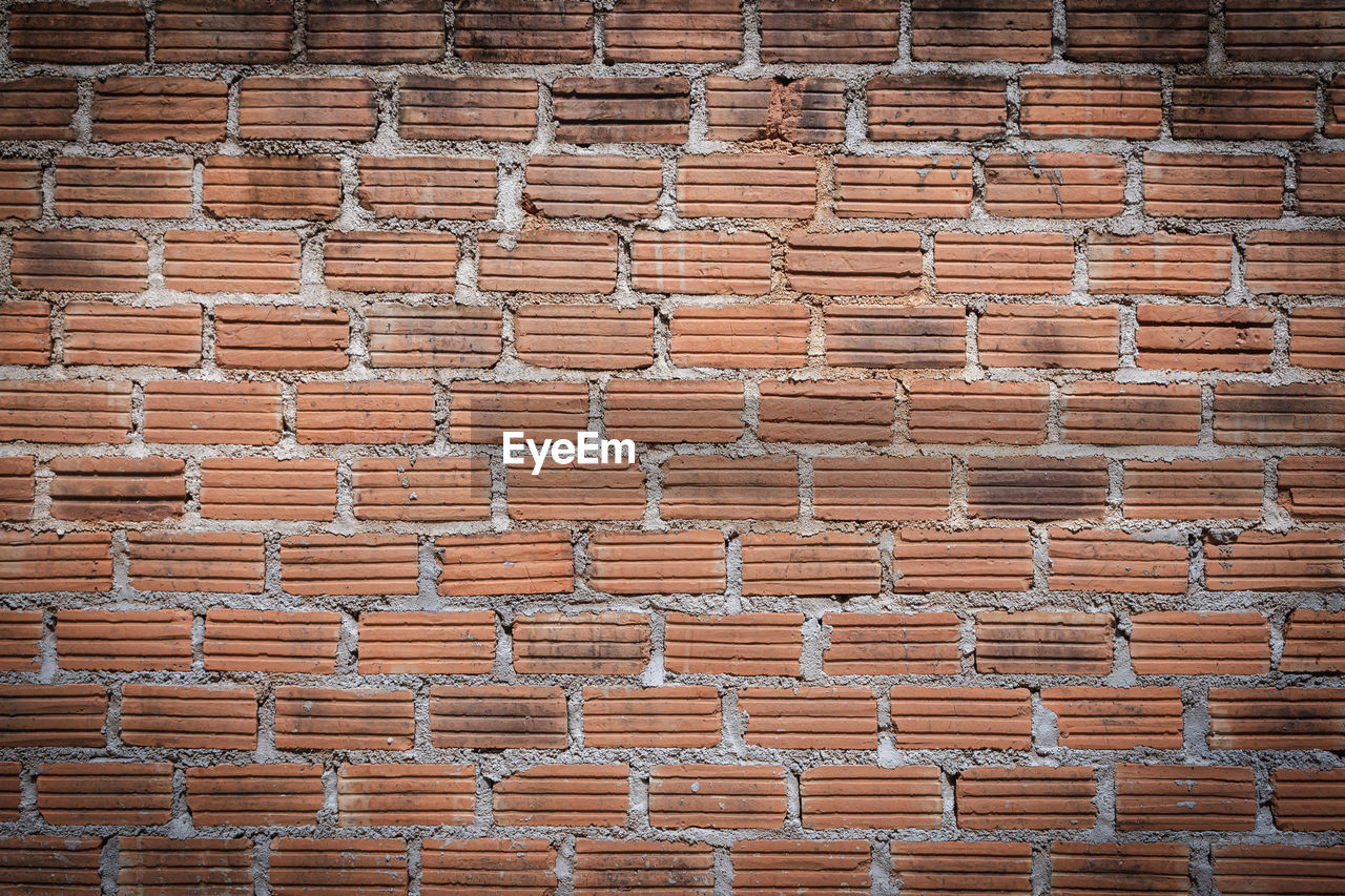 FULL FRAME SHOT OF BRICK WALL IN WINDOW