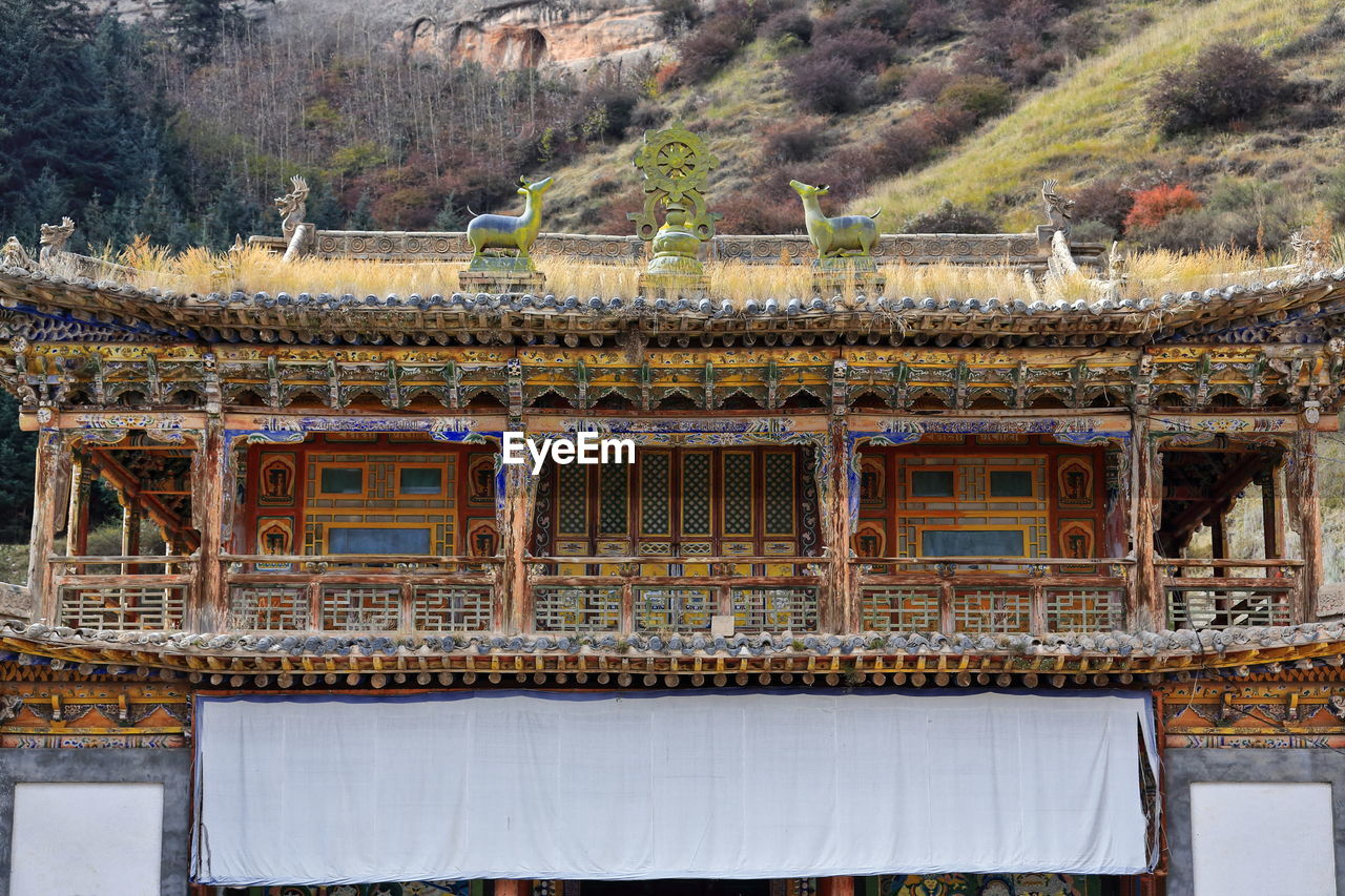 1019 woodcarved polychrome loggia-first floor shengguo temple. mati si-temple-zhangye-gansu-china.