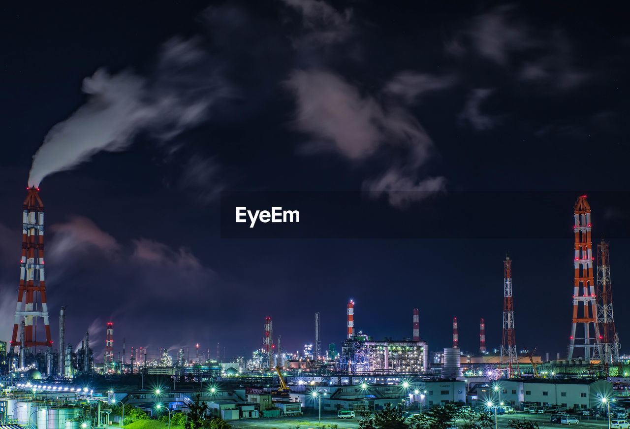 Panoramic view of refinery against sky at night