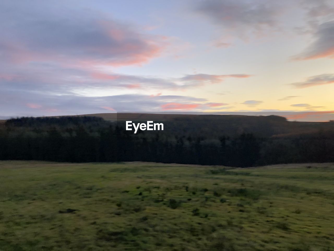 SCENIC VIEW OF LAND AGAINST SKY DURING SUNSET