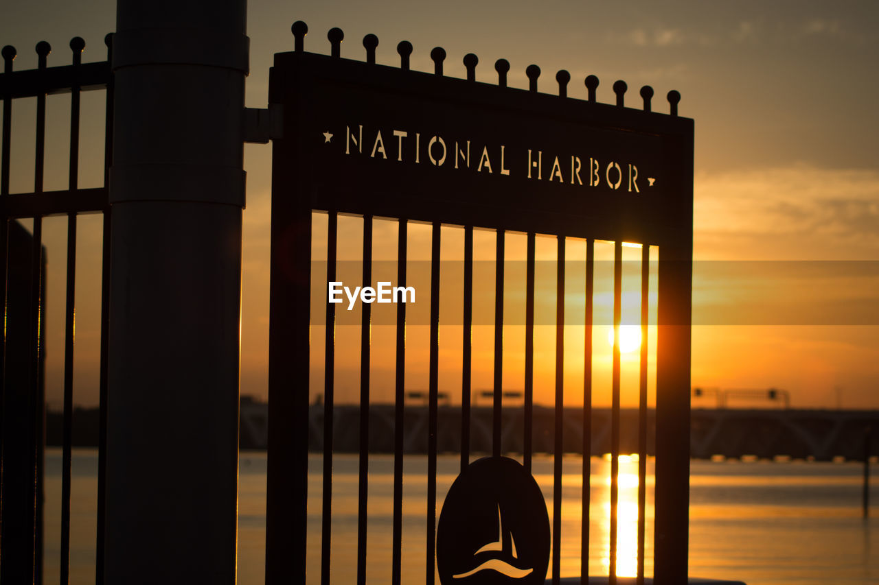 CLOSE-UP OF SILHOUETTE OF BUILDING AT SUNSET