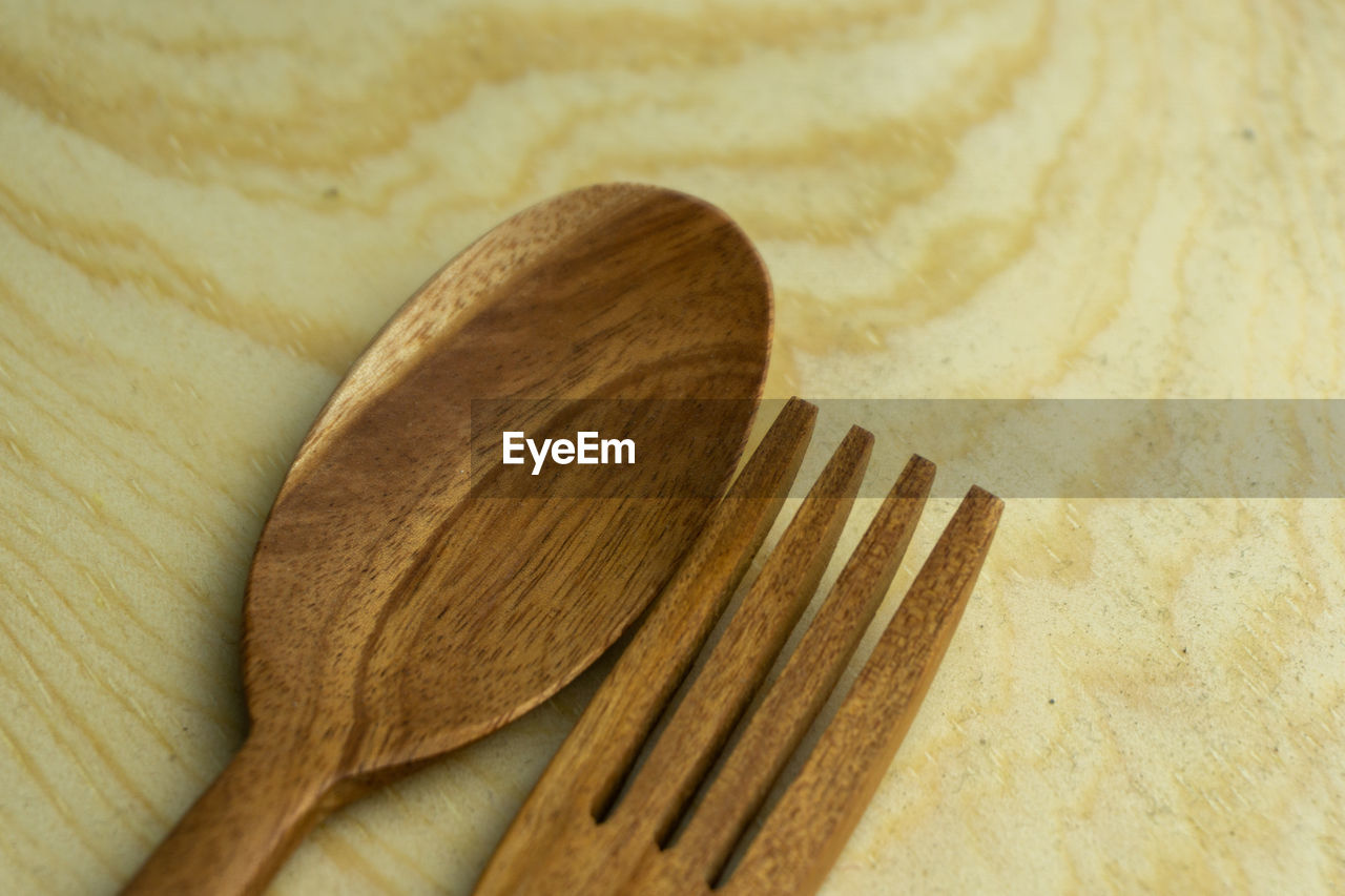 wood, kitchen utensil, wooden spoon, indoors, no people, eating utensil, spoon, close-up, household equipment, silverware, still life, high angle view, brown, food and drink, simplicity, table, tableware